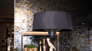 sfeervol terras door de Sunred Compact Artix Bright hangende zwarte heater met 1500 Watt